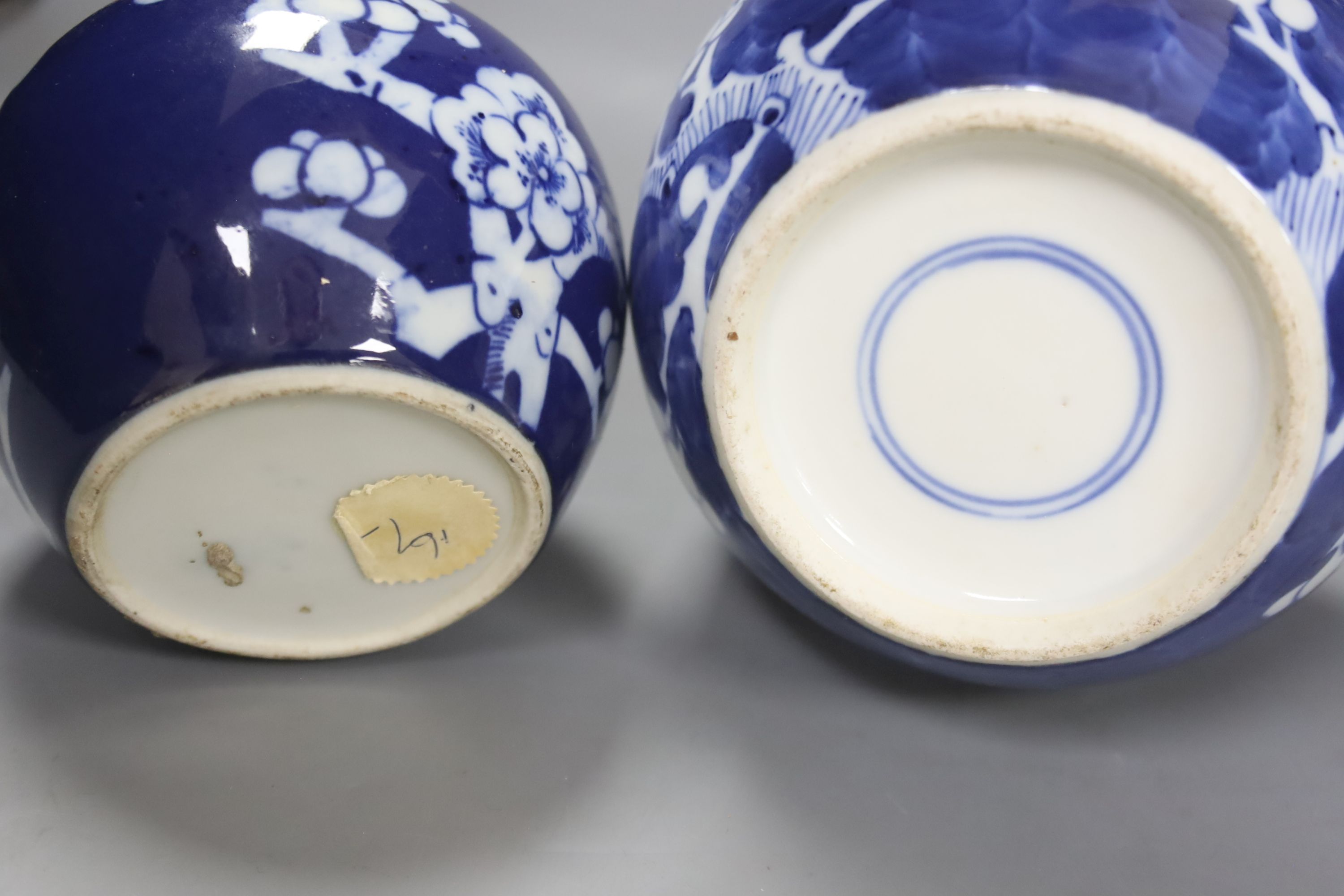An early 20th century Chinese blue and white ‘prunus’ vase a Republic period millefleur dish, a similar Canton vase and two blue and white jars
